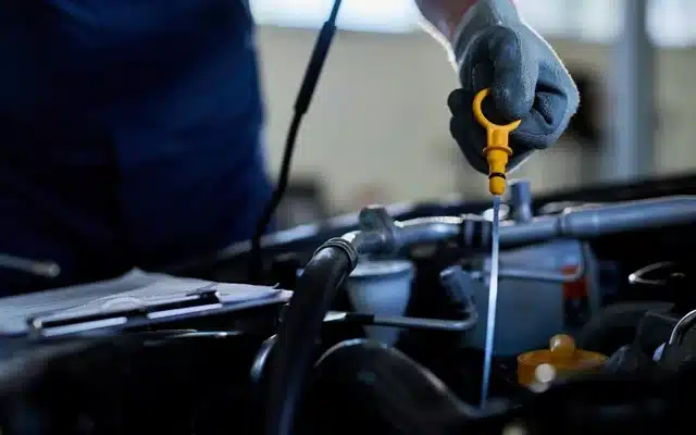 repairman-checking-car-oil